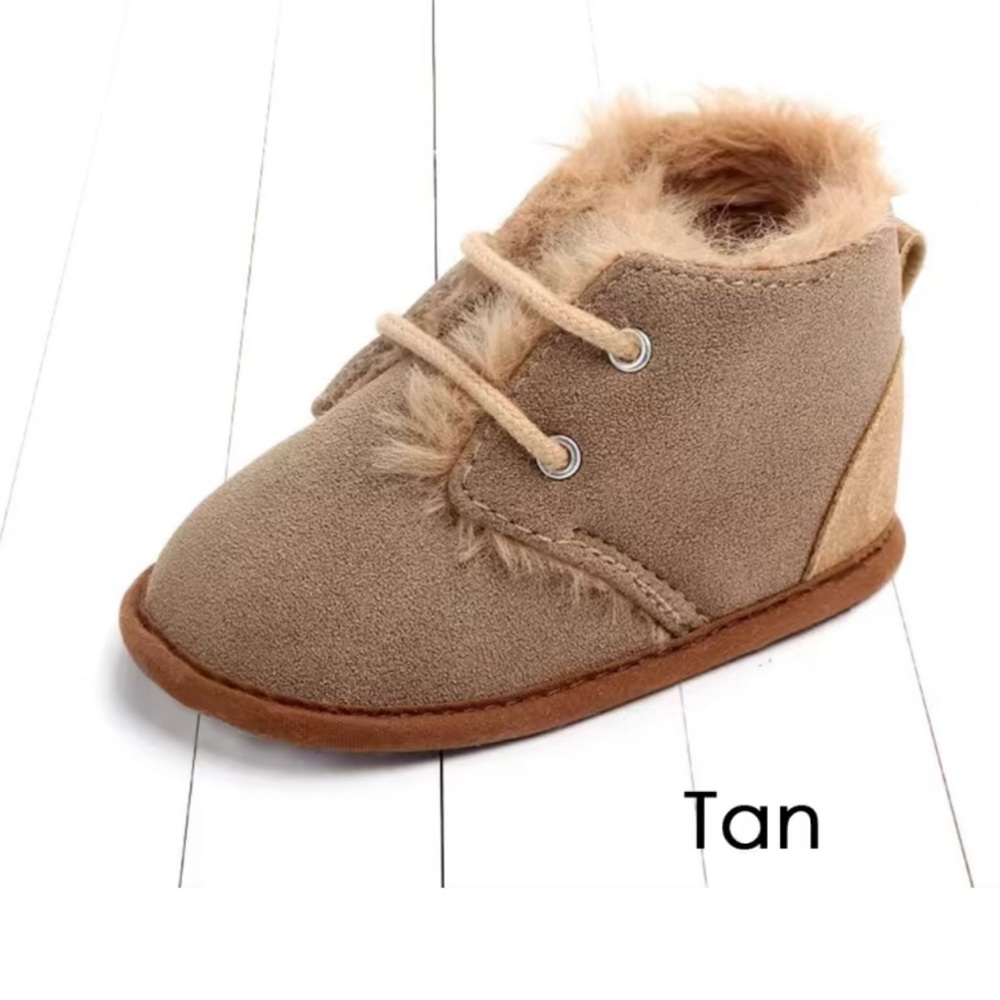 Brand New in Packaging Gender Neutral Baby Moccasins. Size 12-18 months